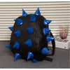 Black PU leather backpack with blue rivets and studs on a gray background.