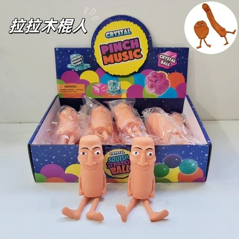 A box set of Crystal Pinch Music toys featuring squishy, orange-colored figures.