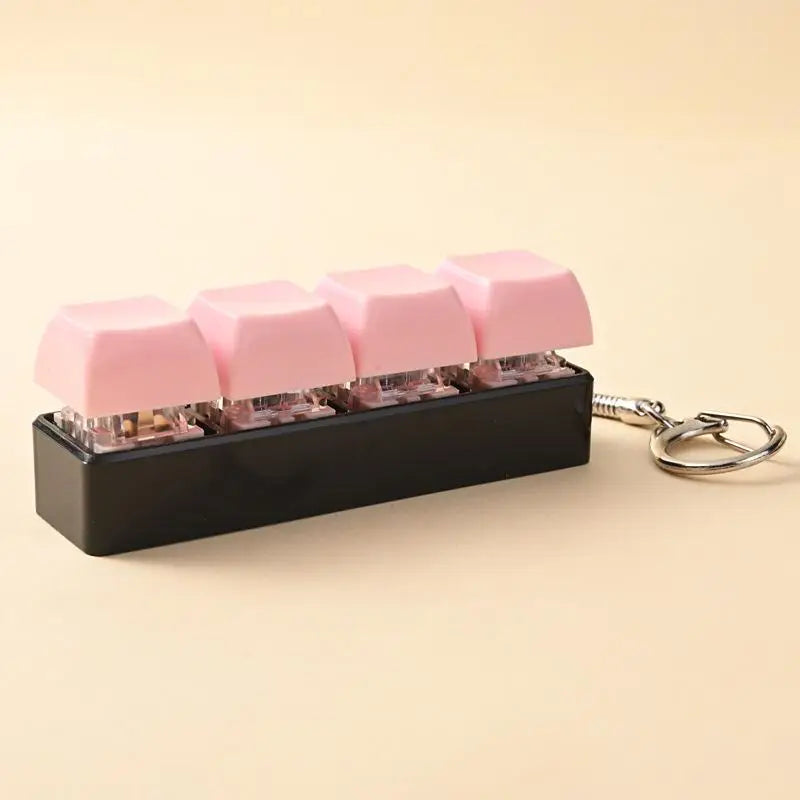 A black keychain holder filled with pink LED mechanical fidget toys.
