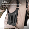 A black multifunctional underarm outdoor vest bag worn on a person's chest, designed for sports and tactical use.