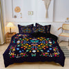 A dark blue floral butterfly duvet cover set with a reversible print displayed on a bed.