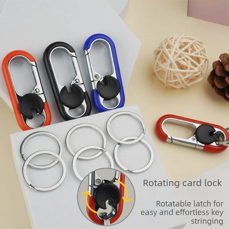 A set of rotating card locks and silver rings on a white surface with a close-up diagram showing the rotatable latch.