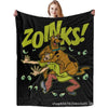 Schwarze Decke mit karikaturartiger Darstellung eines Hundekarakters in grünem Hemd und braunen Hosen mit dem Text ZOINKS!
