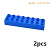 A rectangular blue building block set with multiple studs, shown from the side.