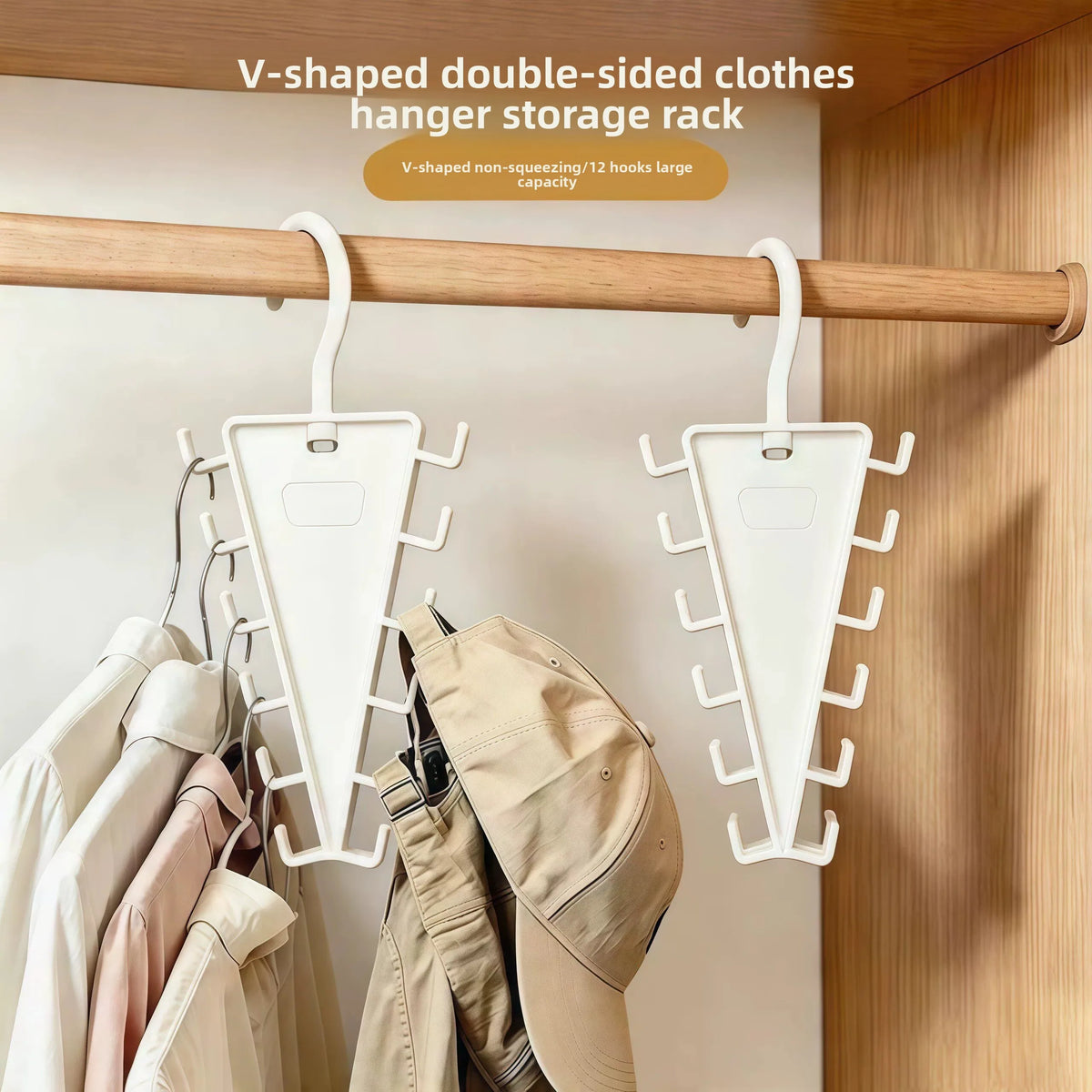 V-shaped double-sided clothes hanger storage rack mounted on a wooden rod in a closet.