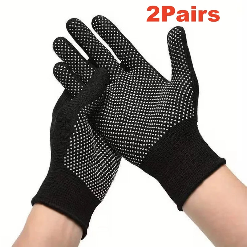 A pair of black knitted anti-slip work gloves with a dotted grip shown on a wrist.