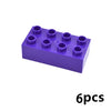 A purple plastic building block set containing six circular blocks.