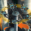 A remote control fighter plane is shown performing a circular flight operation in an industrial setting.