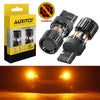 A box and two amber LED turn signal bulbs for automotive use, shown alongside a vehicle headlight example.