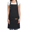 A black cotton canvas apron with multiple pockets and a white shirt worn by a person.