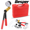 A red brake bleeder and vacuum pump kit with a gauge, hoses, and tools.