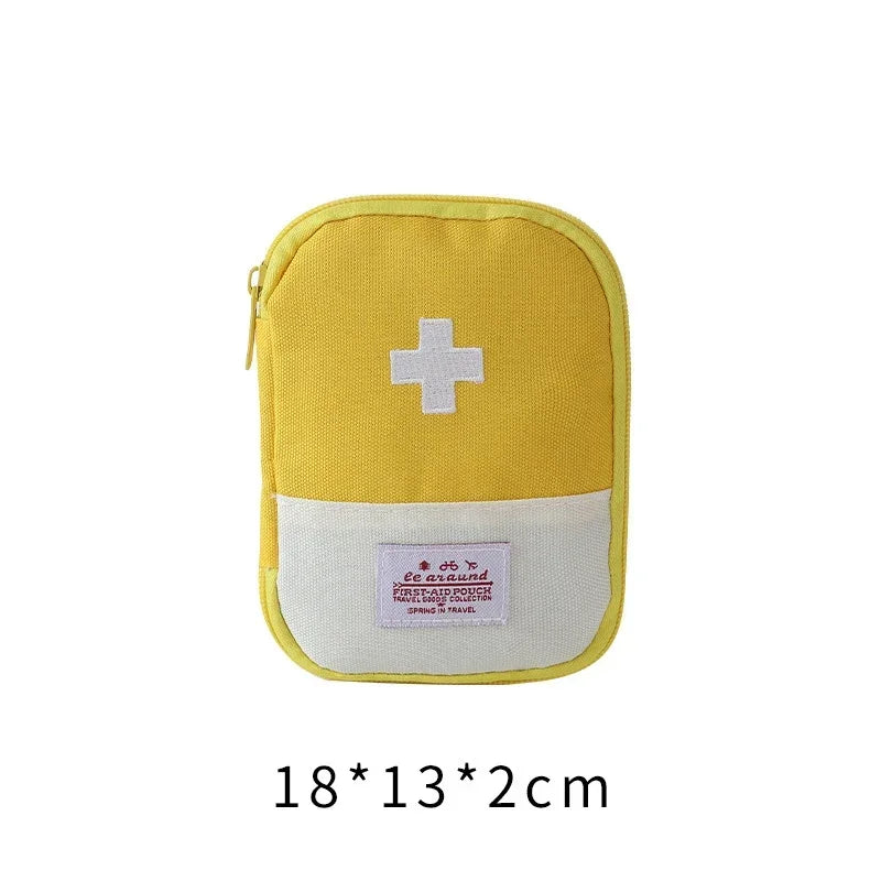 A yellow portable mini first aid kit organizer bag with a white cross symbol on the front.