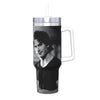 A black and white image of a man is printed on an insulated stainless steel tumbler with a silver straw lid.