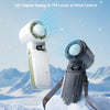 A handheld cooling fan with an LED digital display and wind control settings is shown against a snowy mountain background.
