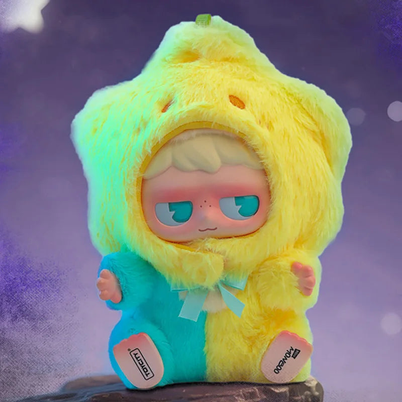 A yellow fluffy monster collectible blind box featuring a light blue face and green accents.