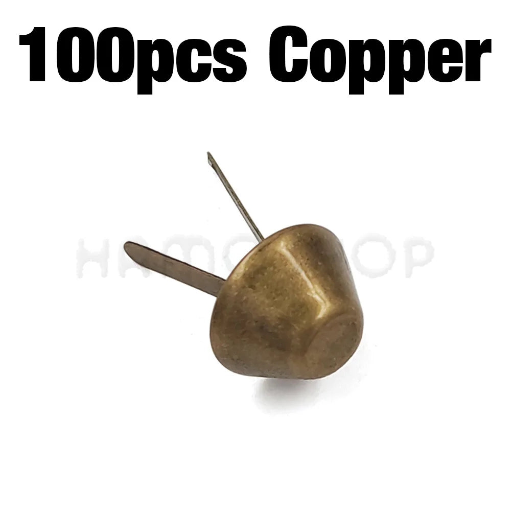 A single copper metal bag bottom foot stud with a thin pin.