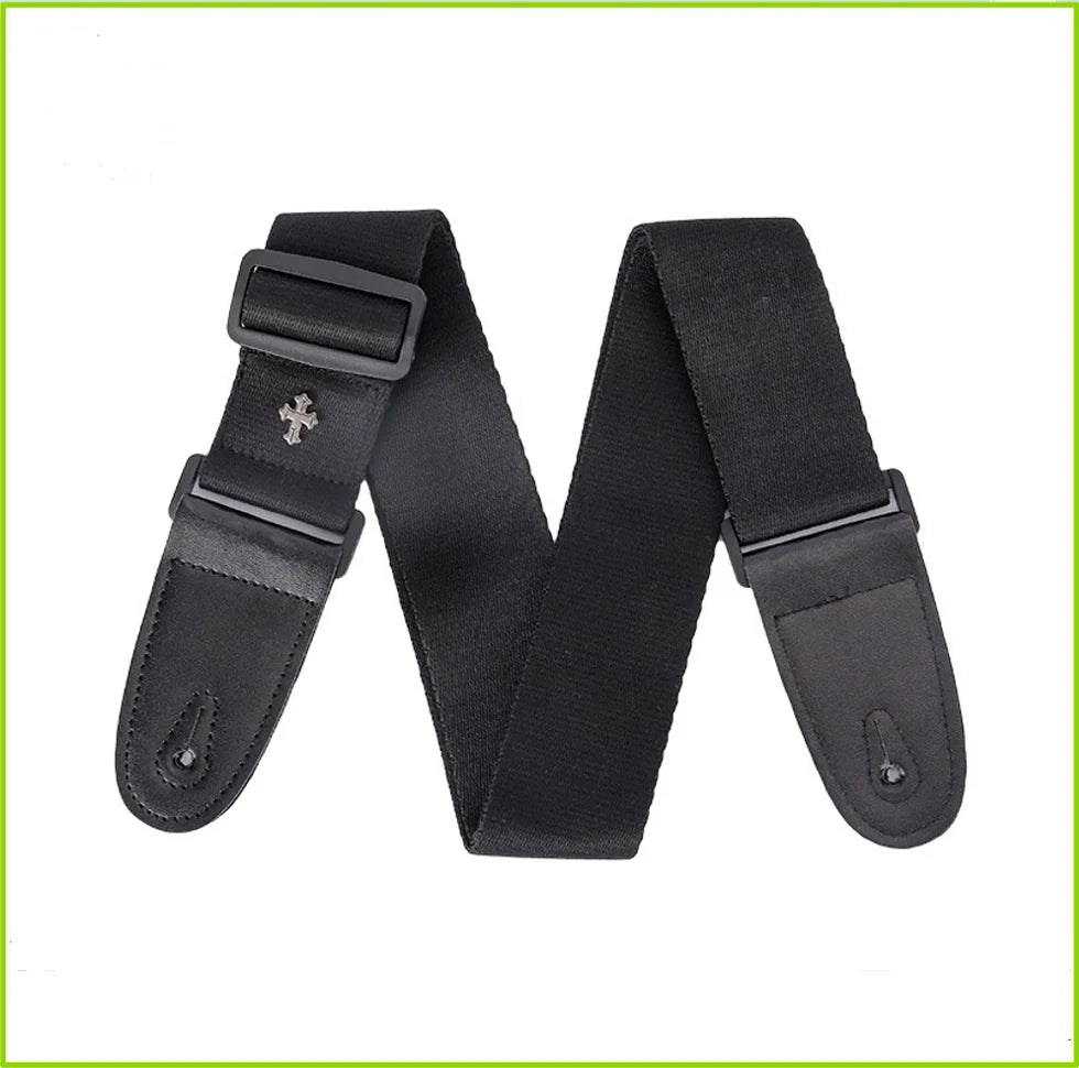 Black guitar strap with a vintage cross pattern and a pick pocket detail.