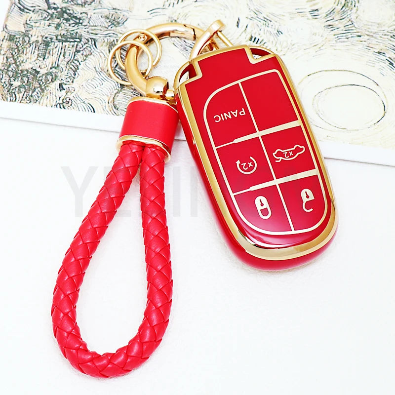 A red TPU car key fob cover with a keyring attached to a red braided cord.