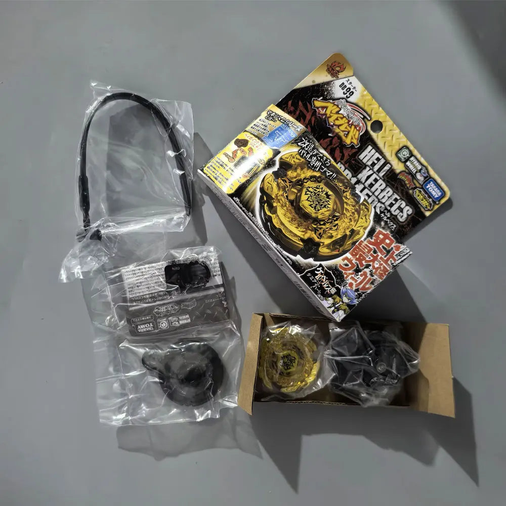 A set of premium metal spinning tops and related accessories packaged in a cardboard box.