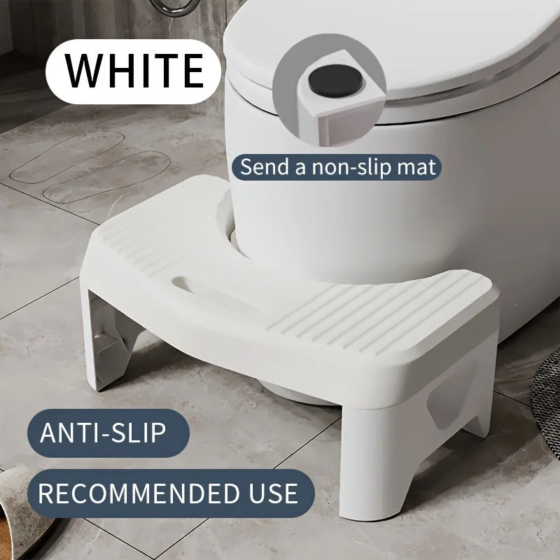 A white comfort squatting stool with an anti-slip seat and a non-slip mat shown in a bathroom setting.