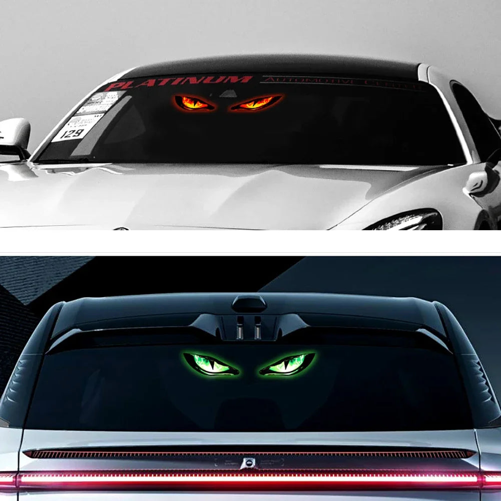 Close-up of a car's rear window with an illuminated devil eye LED warning light.