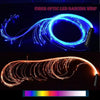 A blue fiber optic LED dancing whip is shown twisting in the air against a dark background.