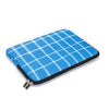 A blue and white checkered laptop sleeve with a black zipper closure.