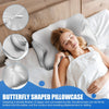 A woman rests her head on a butterfly shaped pillowcase on a white bed, demonstrating the fit of the zippered pillowcase.