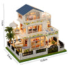 A wooden miniature Japanese sakura tea house kit featuring an upper and lower level with LED lighting and landscaping.
