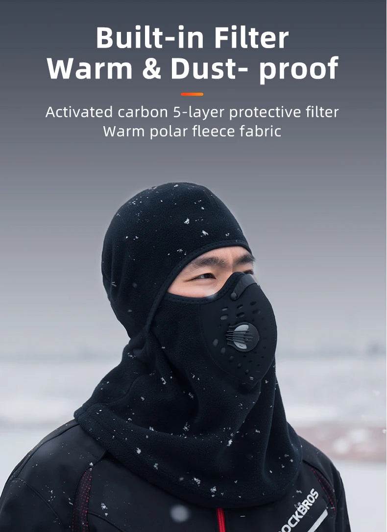 A man wearing a black built-in filter warm and dust-proof balaclava mask in an outdoor setting.