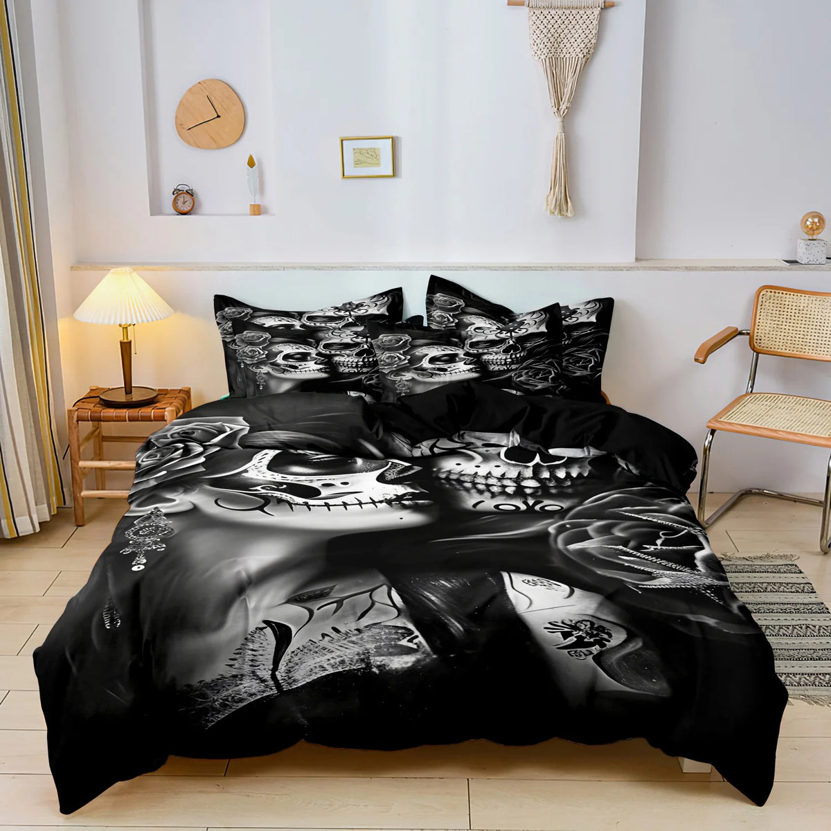 A black duvet cover featuring a detailed monochrome sugar skull design with floral accents on a bed.