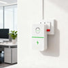 A white voltage stabilizer and energy saver plug mounted on a white wall.