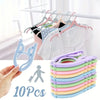A set of ten light-colored foldable travel clothes hangers with anti-slip grips are displayed next to a hand and a person ico