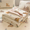 A beige lace-trimmed breathable summer duvet with a light pattern is displayed on a bed with matching pillows.