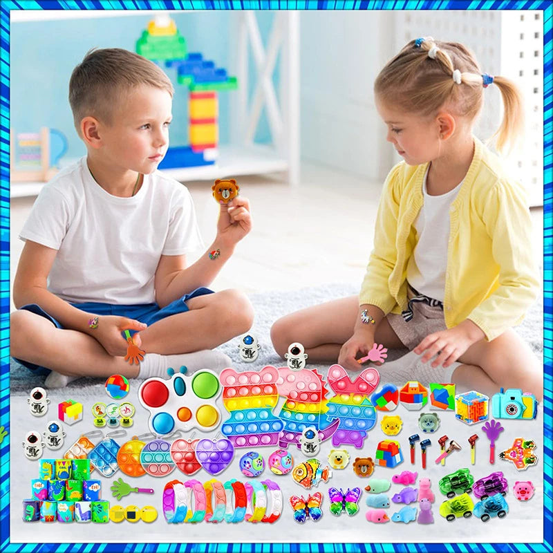 Assortment of kids party favors including snap bracelets, fidget toys, and various small toys.
