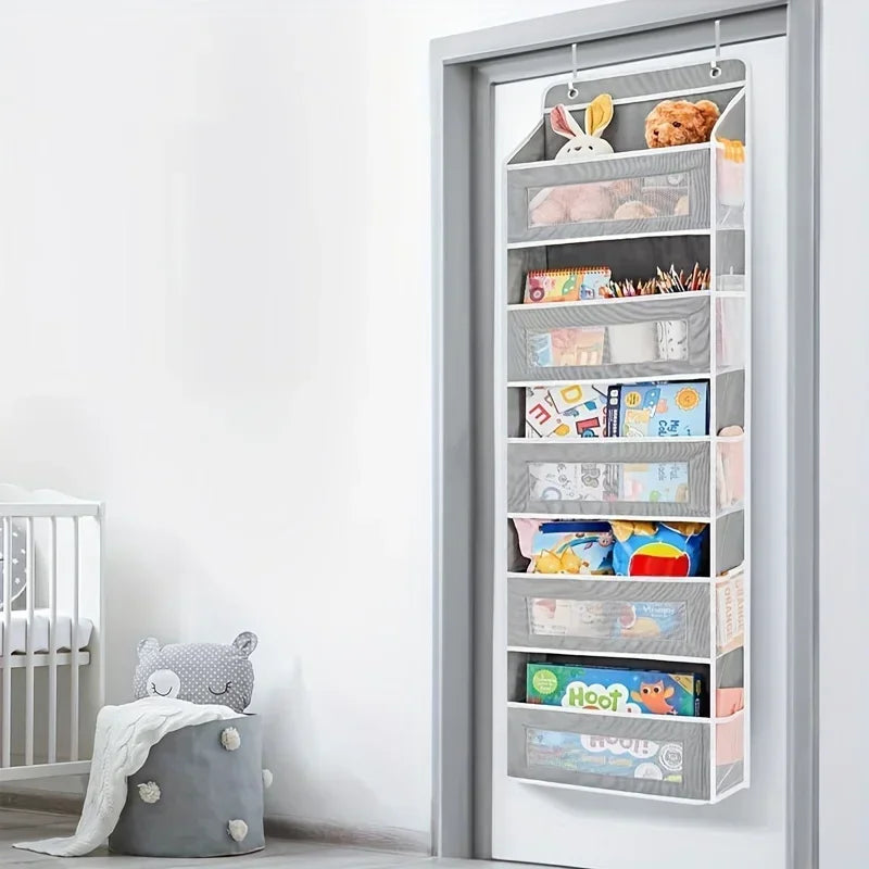 A gray over-the-door hanging storage organizer with multiple compartments for organizing small items.