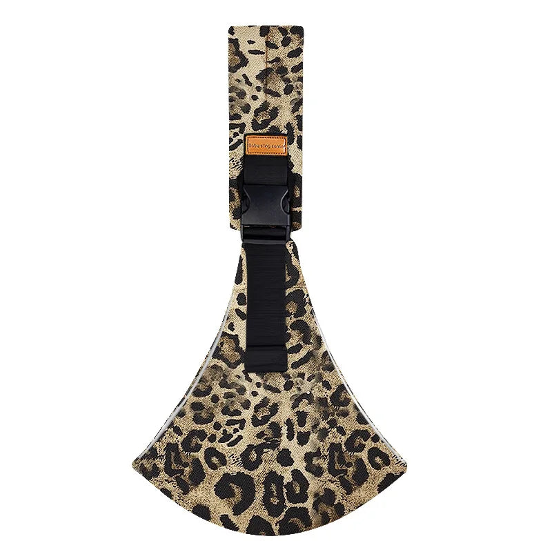 A black ergonomic baby sling carrier with a leopard print fabric and a padded hip seat.