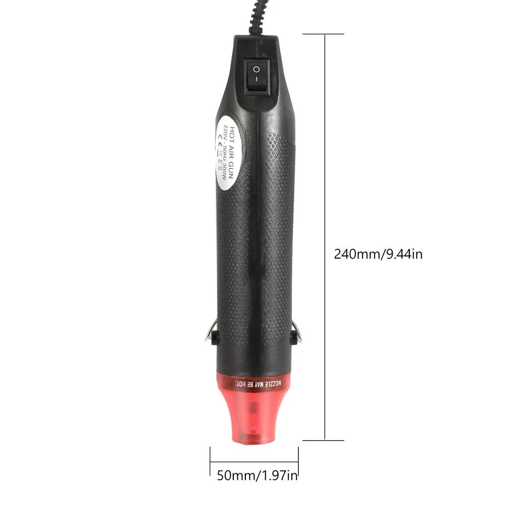 A black compact electric heat gun with a red nozzle and various air modes is shown against a white background.