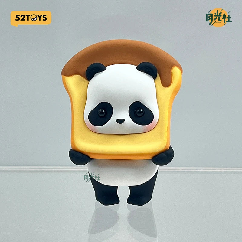 A blind box figure of a panda wearing a yellow, toasted bread-like hat.