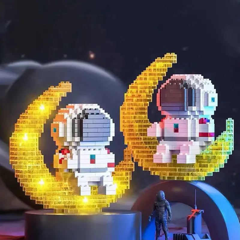 A set of Luminous Astronaut Moon micro building blocks featuring astronauts on a golden crescent moon background.