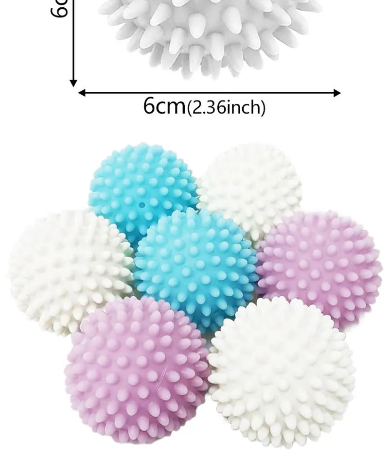 A collection of reusable laundry balls in white, light blue, and purple colors.