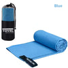 Blue microfiber towel rolled up on a blue fabric surface with a mesh version shown beside it.