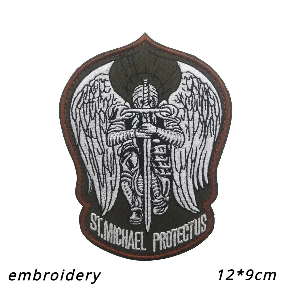 Embroidery of an Archangel St. Michael with wings on a dark patch.