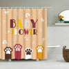 A shower curtain featuring colorful cartoon paw prints and baby shower text on a beige background.