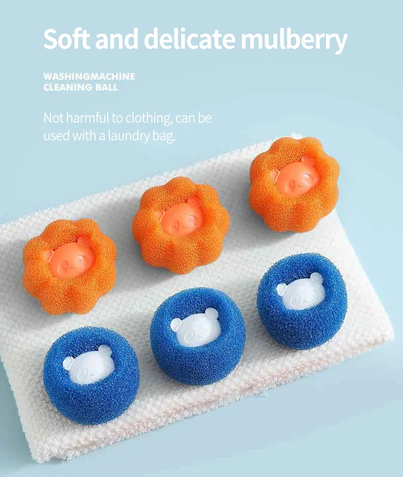 A collection of soft, orange and blue cleaning balls used for laundry, displayed on a white towel.