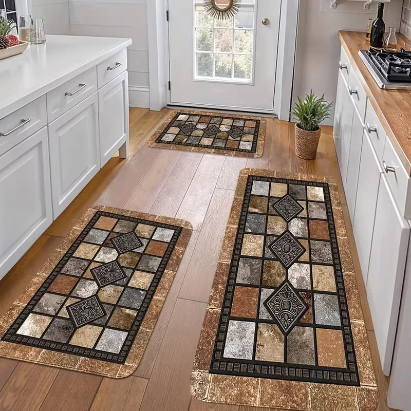 A long rectangular geometric kitchen mat with brown and gray patterns rests on a light wood floor.