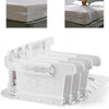 A set of four white adjustable bed sheet corner holders designed to keep sheets tidy.