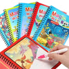A set of colorful reusable magic water drawing books for kids with a red spiral binding and a hand writing on a page.