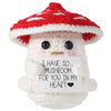 Handmade crochet mushroom animal doll with a red and white spotted cap and a message card