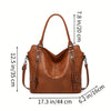 A brown PU leather tote bag with a detachable crossbody strap shown in a side view.
